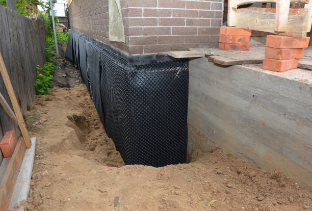 SJ Waterproofing Pros technician performing targeted Emergency Waterproofing assessment in Colfax, IL
